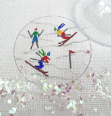 click here to view larger image of Downhill Skiers Ornament w/Clear Dome and Confetti (hand painted canvases 2)